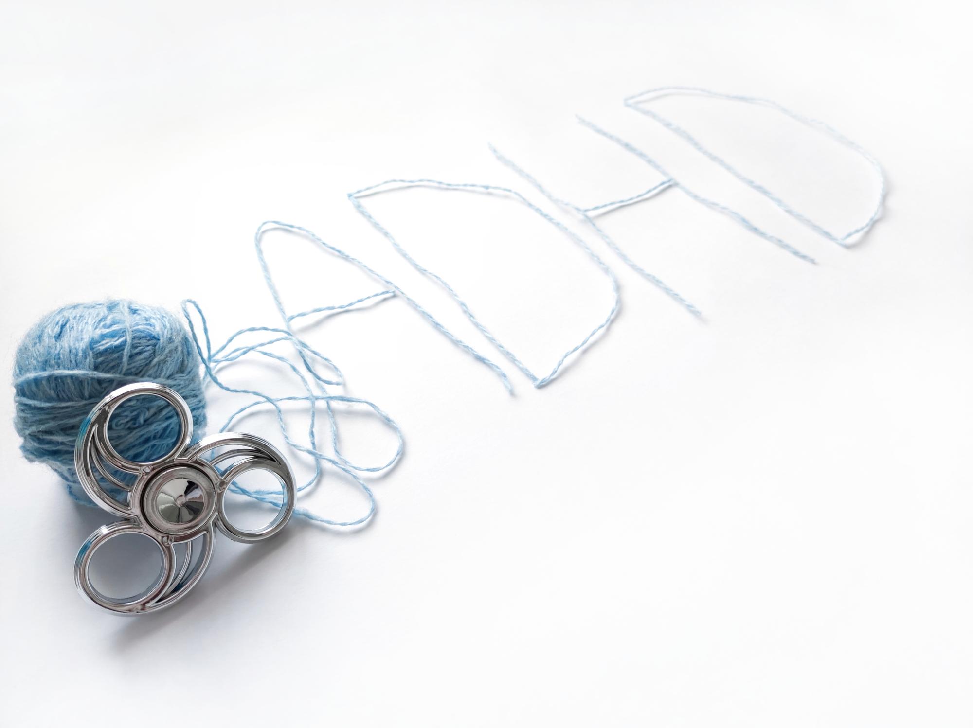 atelier workspace table with threads and pattern sketches